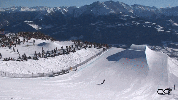 Video of man snowboarding and doing a flip
